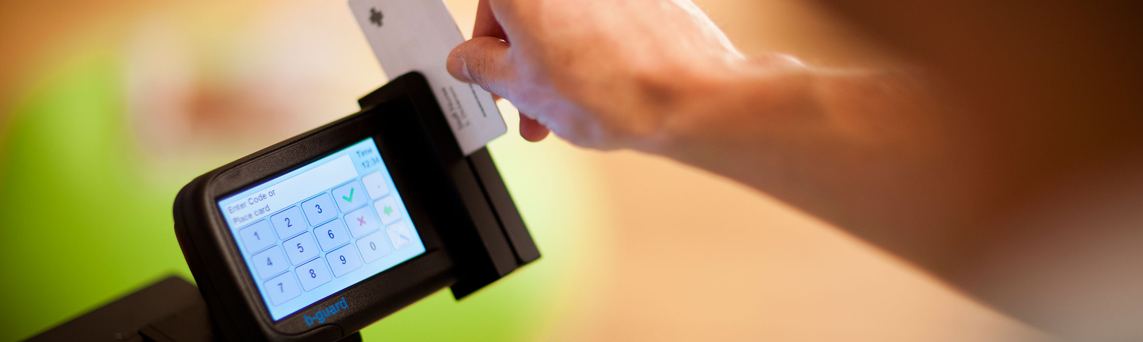 Person using an ID card reader on a Brother printer